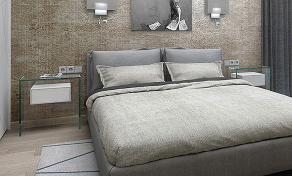 Modern eingerichtetes Schlafzimmer mit Glasnachttisch