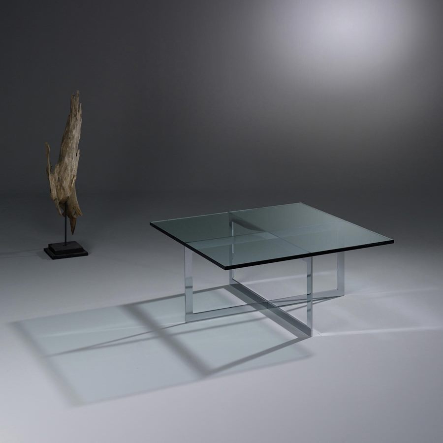 Square MILES with a clear glass top and a chrome-plated crossed frame