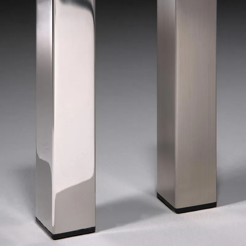 QUADRO · Hand-polished and brushed stainless steel leg · Finish detail
